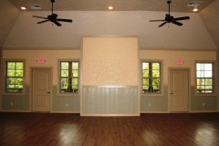 Wide angle view of a large empty meeting room.